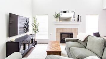 Smart TV, fireplace, foosball, books