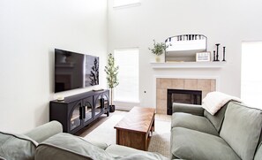 Smart TV, fireplace, table football, books