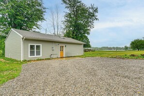 A single-story house with a gravel driveway and a small front yard. - Walk to Shay Lake: Updated Home w/ Water View! (Silverwood)