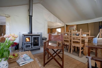 Open plan living room with log burner