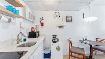 Fridge, microwave, stovetop, coffee/tea maker