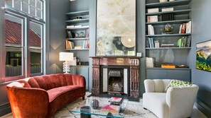 Smart TV, fireplace, books, stereo
