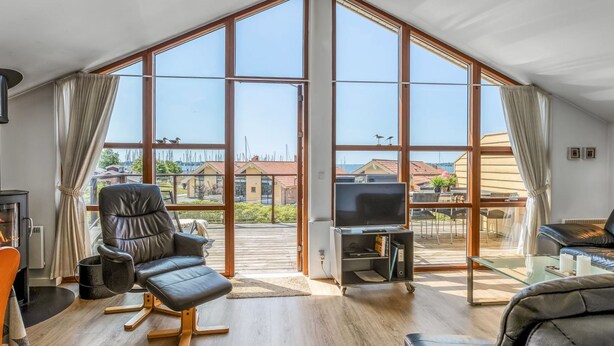 A spacious living room with a large skylight, a fireplace, and a television. - "Era" - 100m from the sea by Interhome (Egernsund)