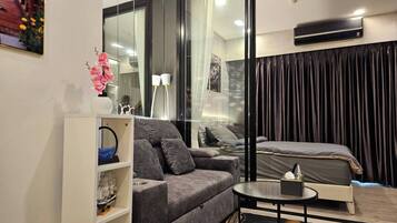 Condo, 1 Bedroom, Balcony | Living room | Flat-screen TV
