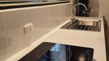 Microwave, coffee/tea maker, cookware/dishes/utensils