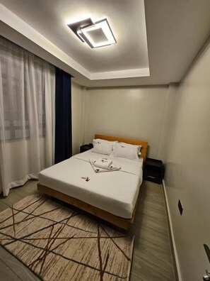 Comfort Apartment, 1 Bedroom, Garden View | In-room safe, individually decorated, laptop workspace, soundproofing - Lumo Residences Eldoret (Eldoret)