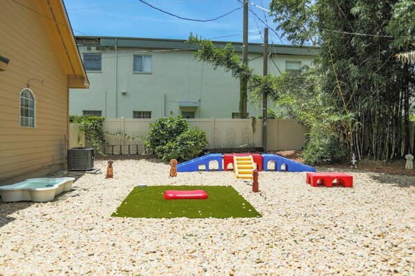 Your furry friends will love their own slice of paradise! Complete with a dog wash tub, toys, running area, and playful climbing structures, it’s the perfect spot for pups to burn energy and cool off after a day of play. Pets deserve a vacation too!