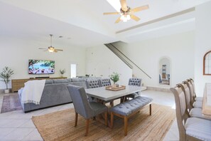Set just off the kitchen, this welcoming dining area comfortably seats six and offers a more intimate setting for meals or conversation—ideal for families, kids, or a quiet dinner away from the main group.
