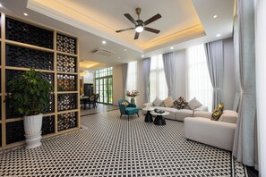 Superior Villa, 4 Bedrooms, Bathtub, Garden View | Living area | 42-inch Smart TV with cable channels, pay movies, offices - Fortune Home Luxury Villa Kem Beach (Phu Quoc)