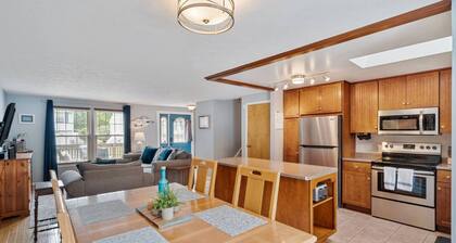 A dreamy Seneca Lake retreat with sweeping views, a relaxing hot tub under the stars, flexible bedroom setups, a fully stocked kitchen, cozy living spaces, and easy access to the lake, wineries, and waterfalls.