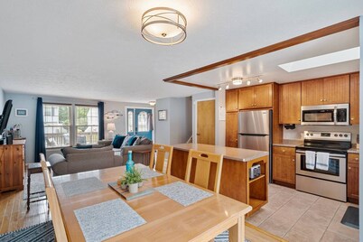 A dreamy Seneca Lake retreat with sweeping views, a relaxing hot tub under the stars, flexible bedroom setups, a fully stocked kitchen, cozy living spaces, and easy access to the lake, wineries, and waterfalls.