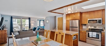 A dreamy Seneca Lake retreat with sweeping views, a relaxing hot tub under the stars, flexible bedroom setups, a fully stocked kitchen, cozy living spaces, and easy access to the lake, wineries, and waterfalls.