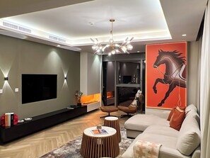 Deluxe Apartment, City View | Living area | 65-inch flat-screen TV with digital channels - KeyRock Living - Skyline at Paramount (Dubai)