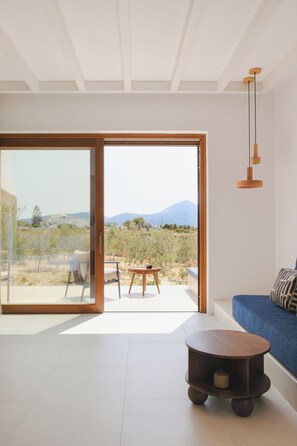 Suite with Garden View - Ground Floor - Spora | Roupas de cama antialérgicas, ferros/tábuas de passar roupa