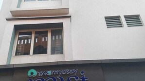 A multi-story building with a sign for 'Myst Stay.' - Tag my stay mist (Chennai)
