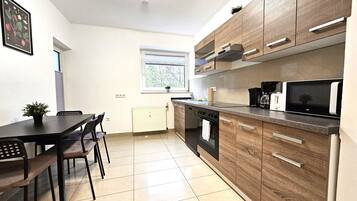 Premium Apartment, Balcony, Courtyard View | Private kitchen | Electric kettle