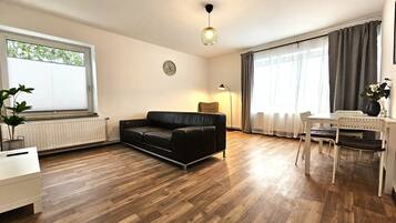 Premium Apartment, Courtyard View | Living area | Flat-screen TV