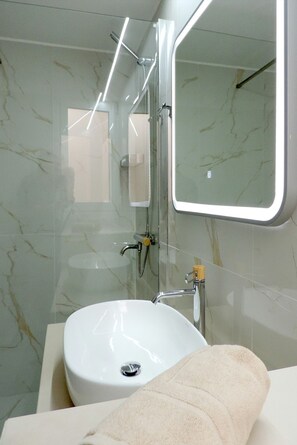 Shower, hair dryer, towels, soap