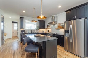 Fridge, microwave, oven, stovetop - The NASH | 8BR Designer Duplex w/ Hot Tub, Rooftops, Shuffleboard & More | Sleeps 24 (Nashville)
