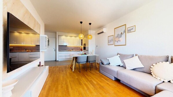 Deluxe Apartment, Balcony, Sea View | Living area | 43-inch LCD TV with cable channels, Netflix, streaming services