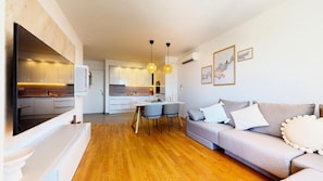 Deluxe Apartment, Balcony, Sea View | Living area | 43-inch LCD TV with cable channels, Netflix, streaming services