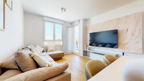 Deluxe Apartment, Balcony, Sea View | Living area | 43-inch LCD TV with cable channels, Netflix, streaming services