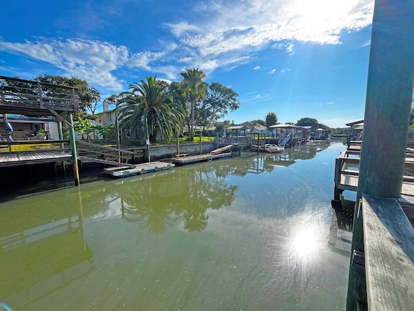 A calm water body with docks and a clear sky. - DeStoto Canal Oasis w/ Boat Lift. Walk to Beach! (St. Augustine)