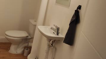 Shower, towels, soap, toilet paper