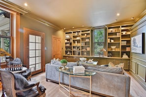 Smart TV, fireplace, books, offices