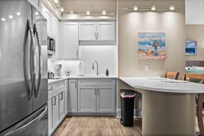 Fridge, microwave, stovetop, coffee/tea maker