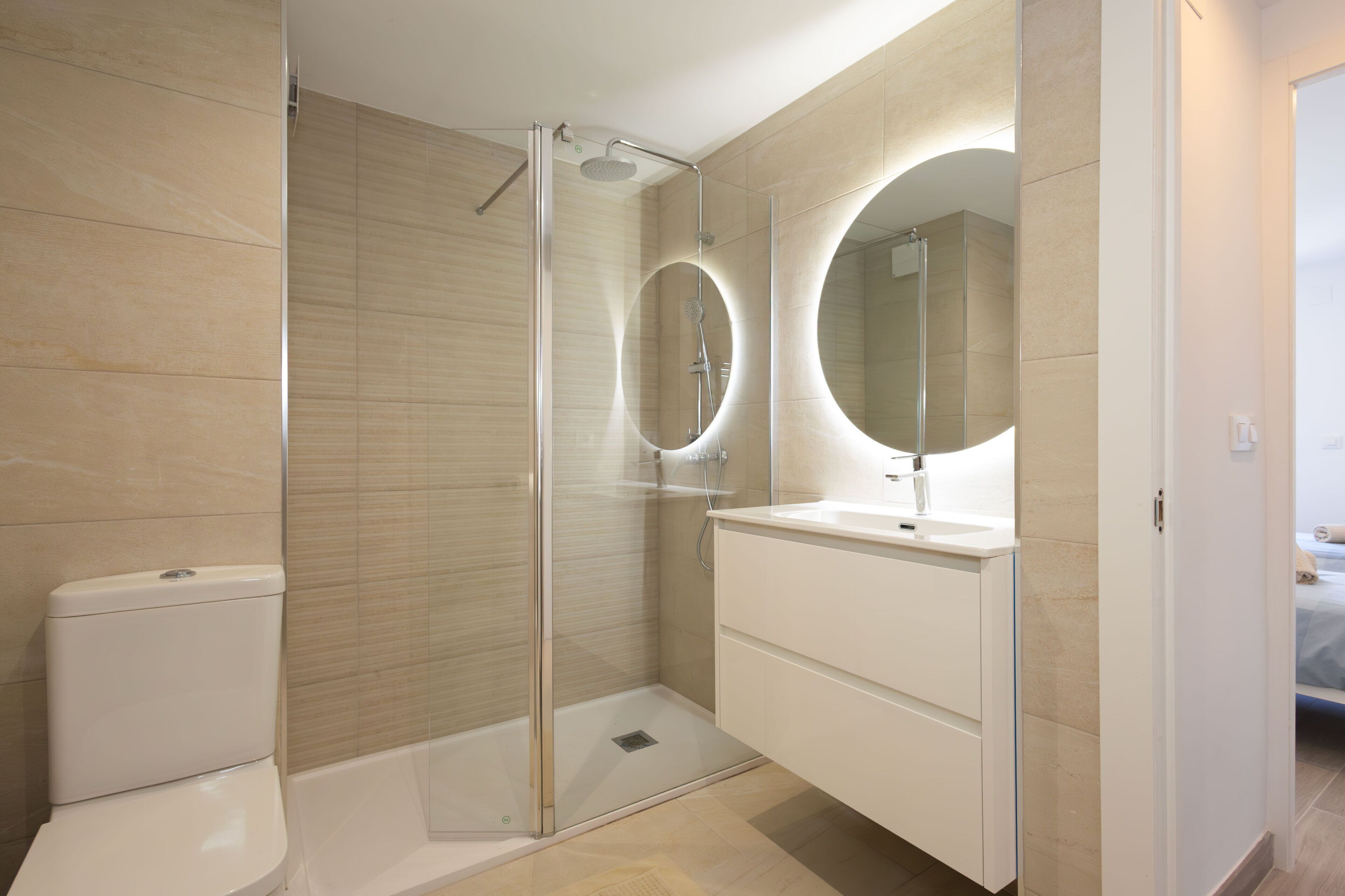 Shower, hair dryer, towels, toilet paper