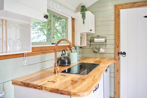 Fridge, coffee/tea maker, toaster, cookware/dishes/utensils