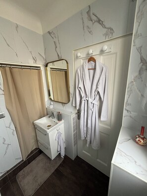 Shower, hair dryer, towels, soap