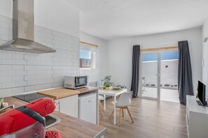 Fridge, microwave, stovetop, coffee/tea maker