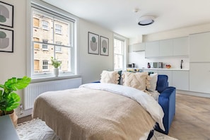 1 bedroom, desk, iron/ironing board, travel crib