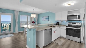 A modern kitchen with white cabinets, a built-in microwave, a stainless steel oven, and a dishwasher. - 🌊Gulf View-Steps to Beach-Heated Pool-Islander Beach Resort 2002🌅 (Fort Walton Beach)