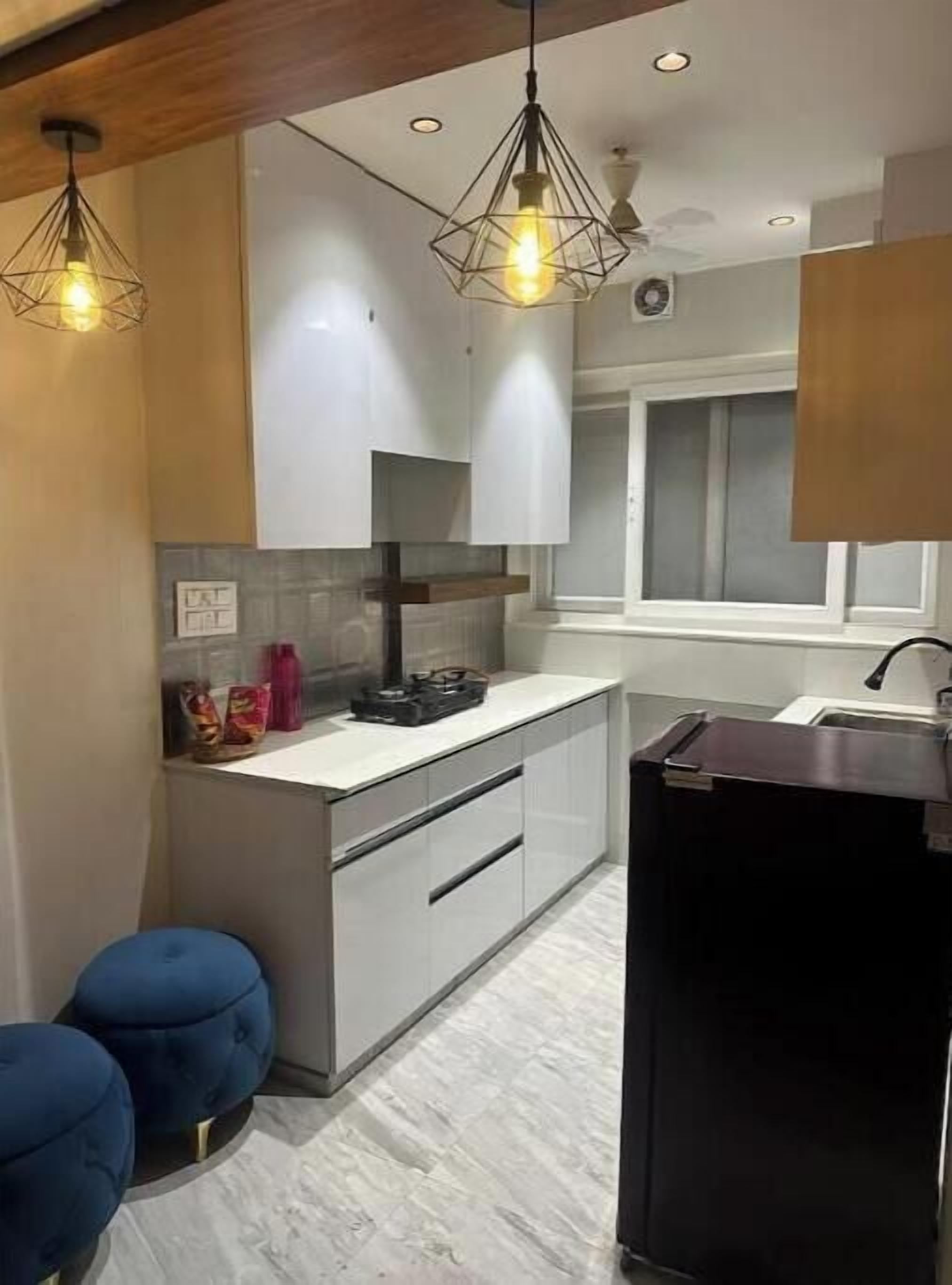 Fridge, electric kettle, cookware/dishes/utensils