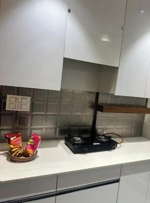 Fridge, electric kettle, cookware/dishes/utensils
