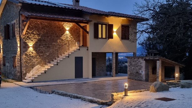 A two-story house with a stone facade, a staircase, and a well-lit entrance. - Villa for family/friends, few minutes from the most beautiful medieval villages (Umbria)