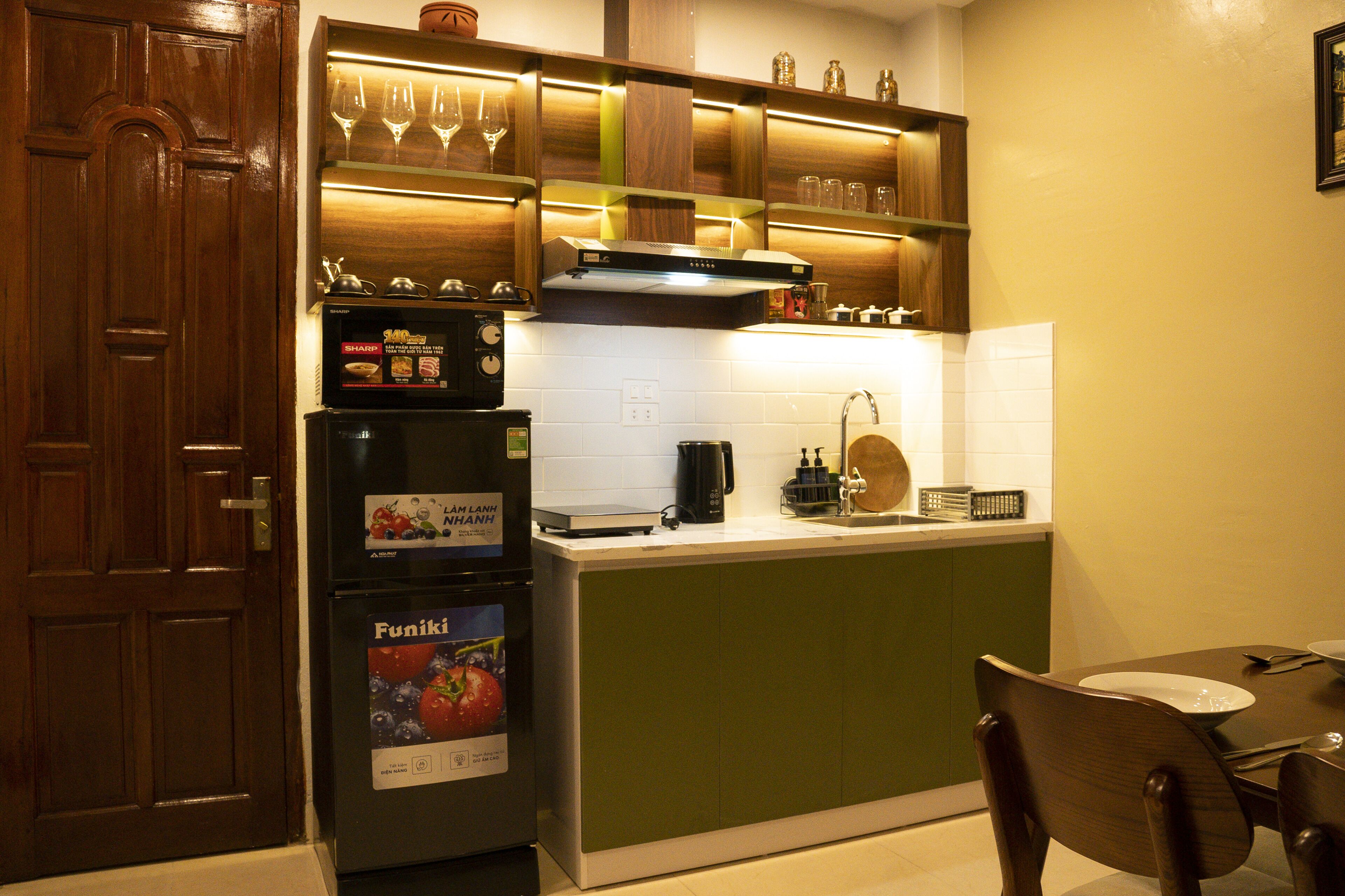 Fridge, microwave, electric kettle, cookware/dishes/utensils