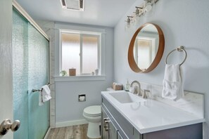 Shower, hair dryer, towels, shampoo