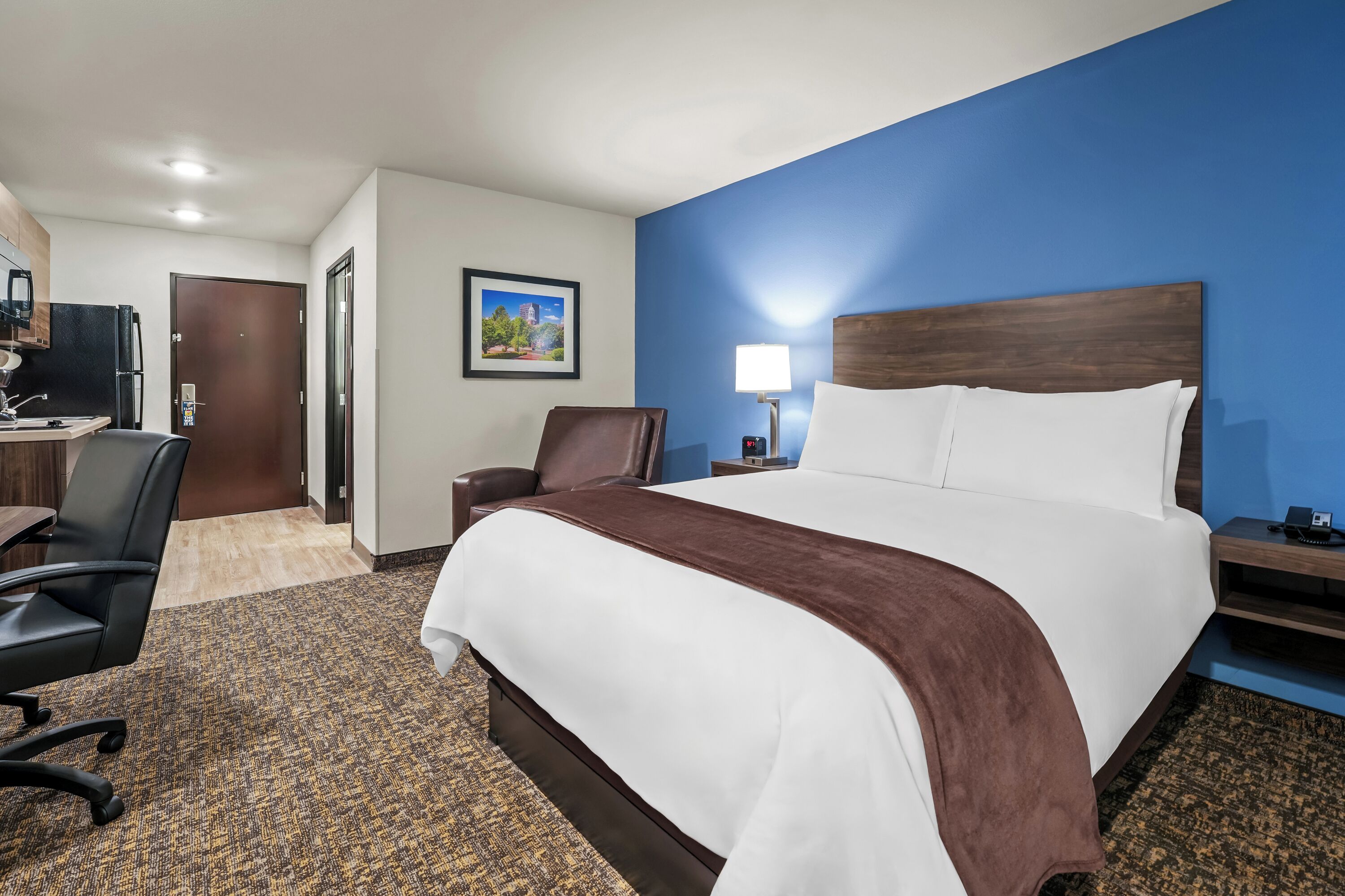 Desk, laptop workspace, blackout drapes, iron/ironing board