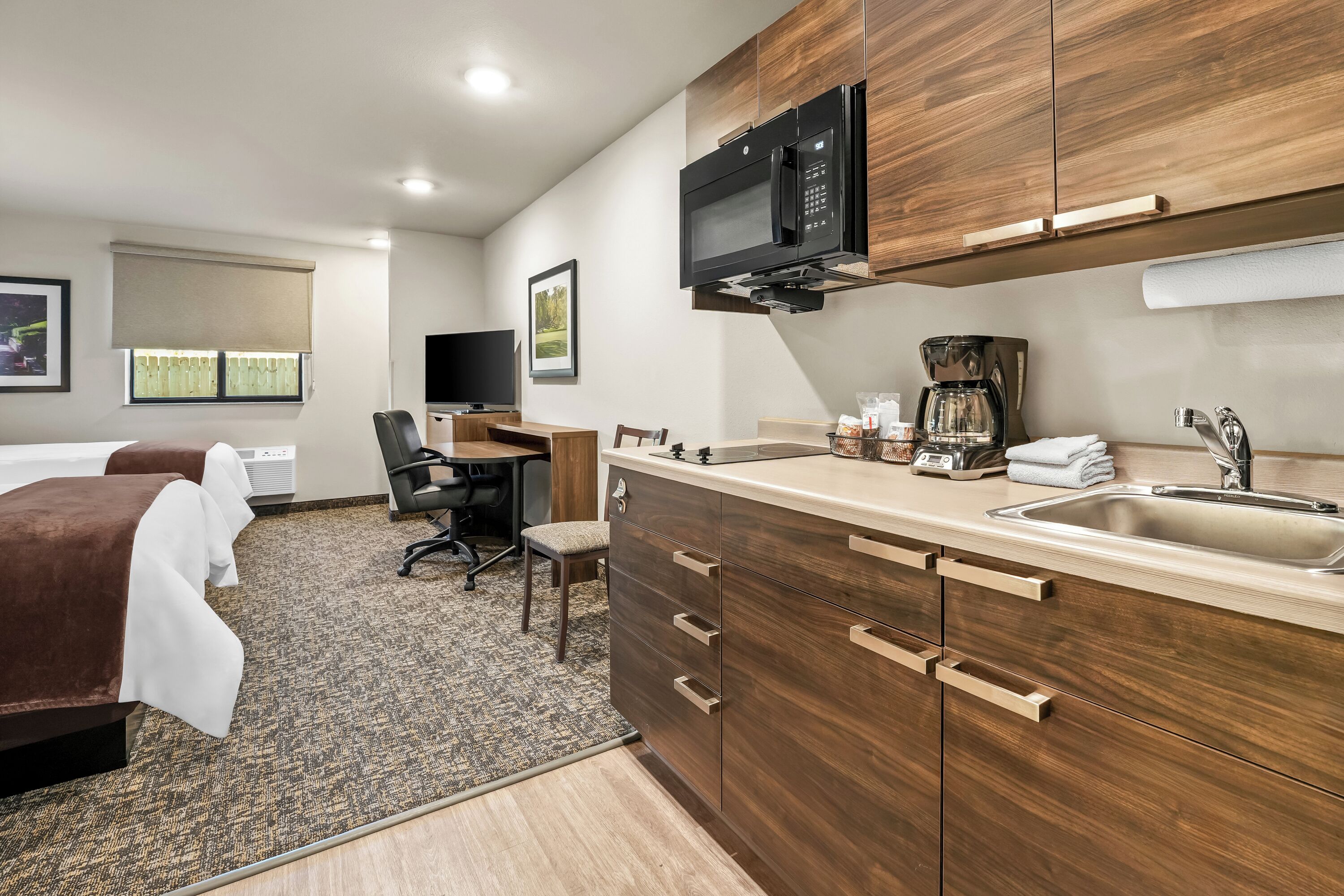 Full-size fridge, microwave, stovetop, coffee/tea maker