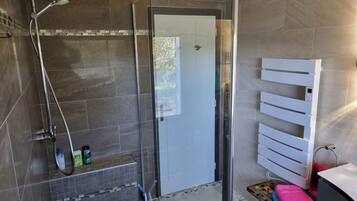 Shower, hair dryer, towels, soap