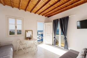 Family Apartment, Balcony, City View | Living area | Flat-screen TV