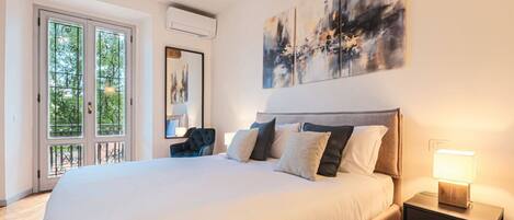 Desk, iron/ironing board, bed sheets