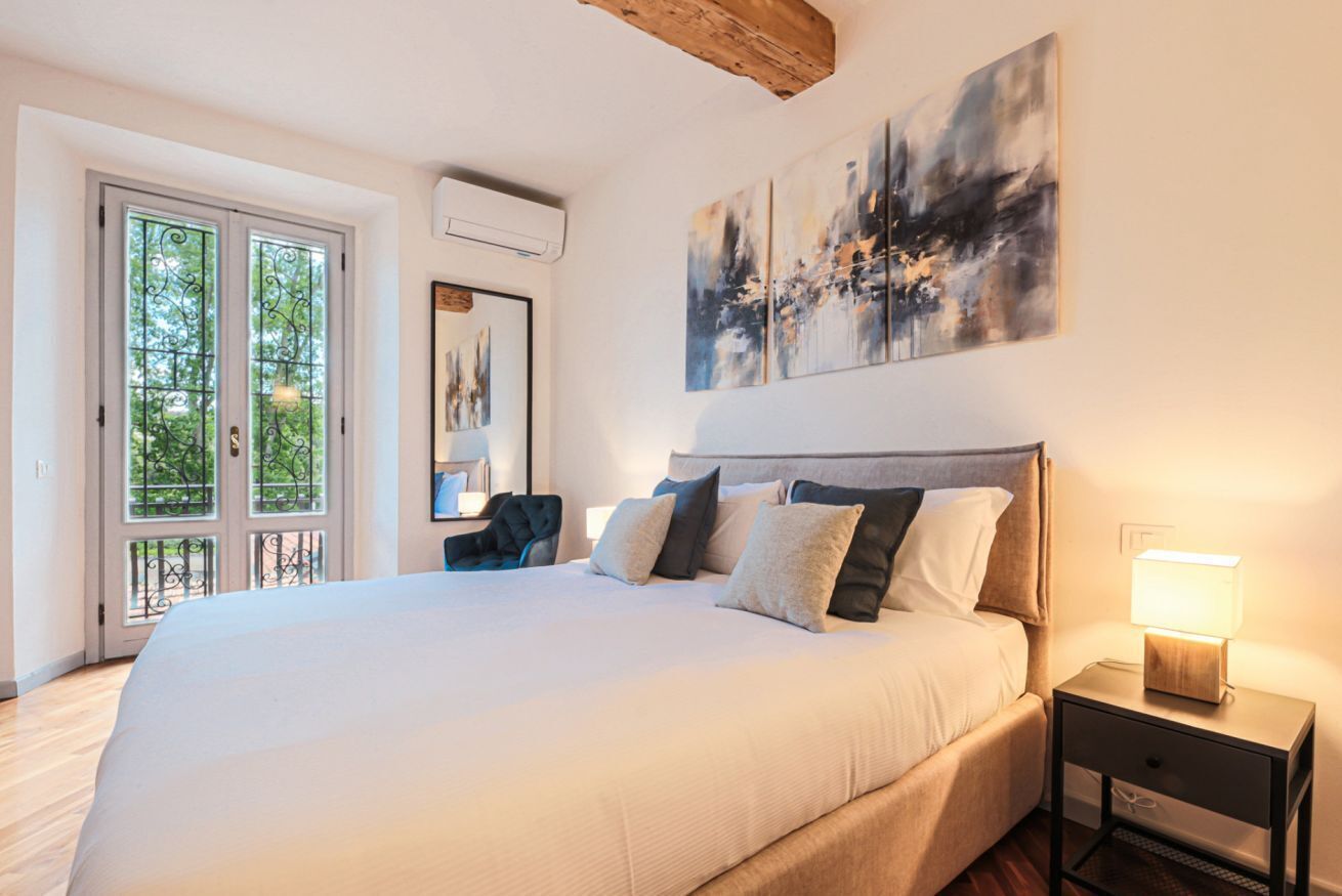 Desk, iron/ironing board, bed sheets