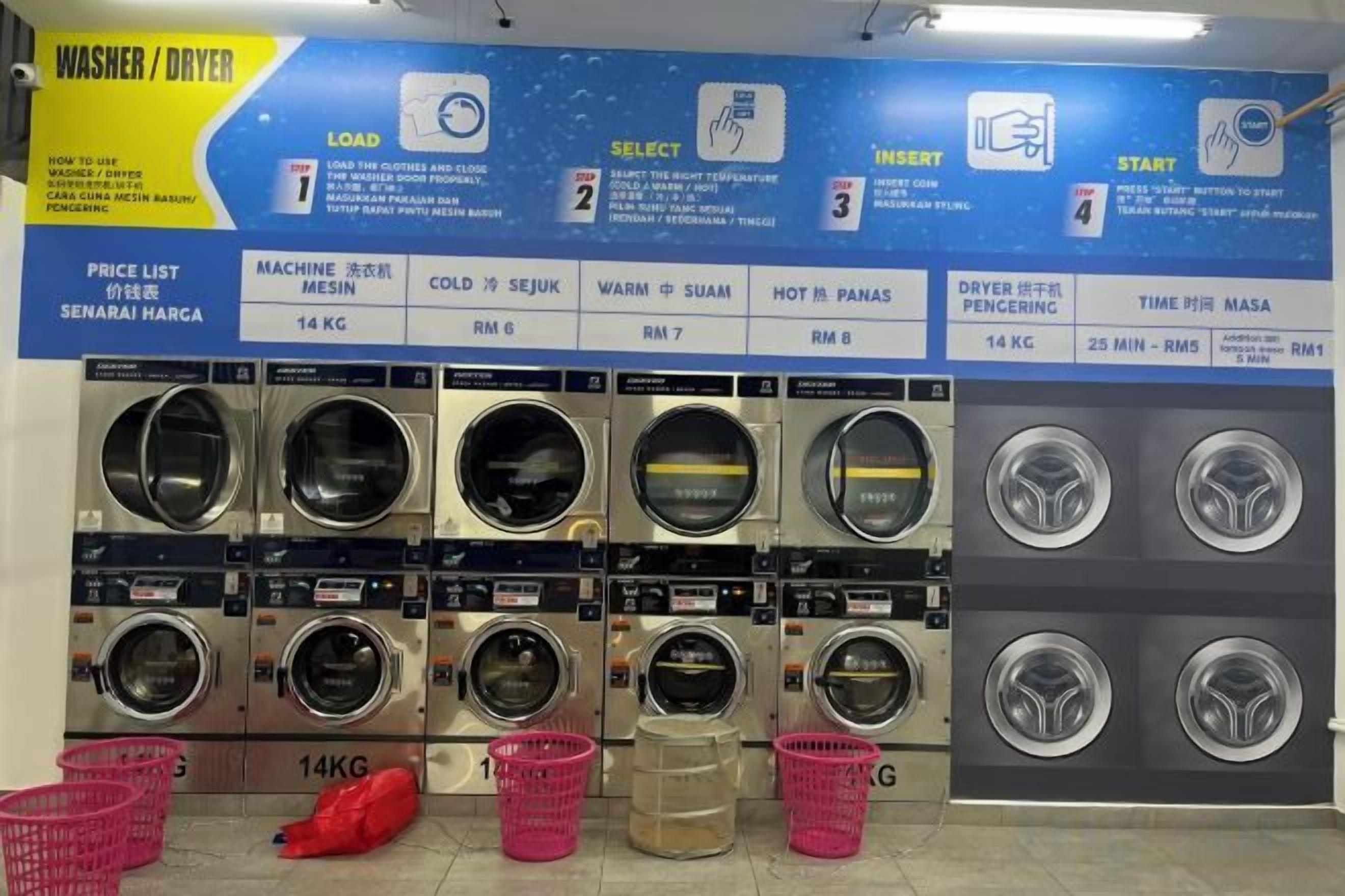 A laundry facility with multiple washing machines and dryers, price list, and instructions.