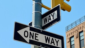 Street signs for W 45 st and 10 Av, a one-way sign, and a traffic light. - NYC Studio with Private Bathroom & Kitchenette 45 street Time Square (New York)