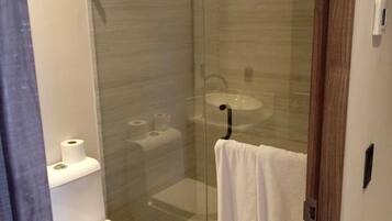 Deluxe Apartment, Balcony, Sea View | Bathroom | Bathtub, hair dryer, towels, soap